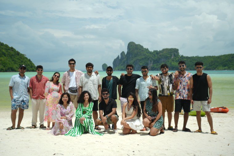A group on a beach on an incentive trip planned by TrippingCube