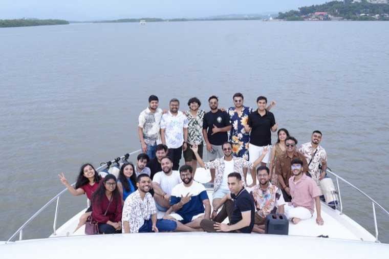A team on a yacht on a day out planned by TrippingCube