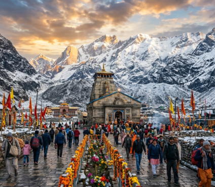 Pilgrims walking toward Kedarnath Temple during the Char Dham Yatra, surrounded by the snow-covered Himalayan mountains in Uttarakhand.