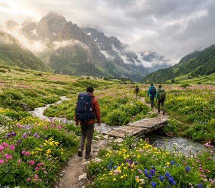Trekkers exploring Valley of Flowers, Uttarakhand during the monsoon season with colorful alpine flowers, wooden bridge, mountain stream, and majestic Himalayan peaks.