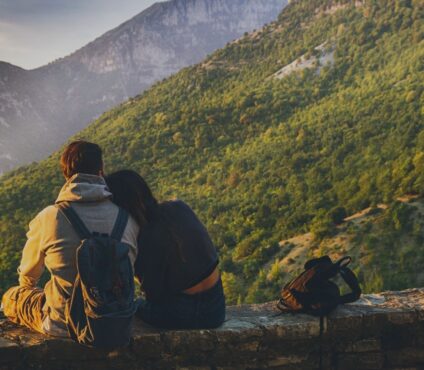 Couple enjoying a scenic mountain view on their honeymoon