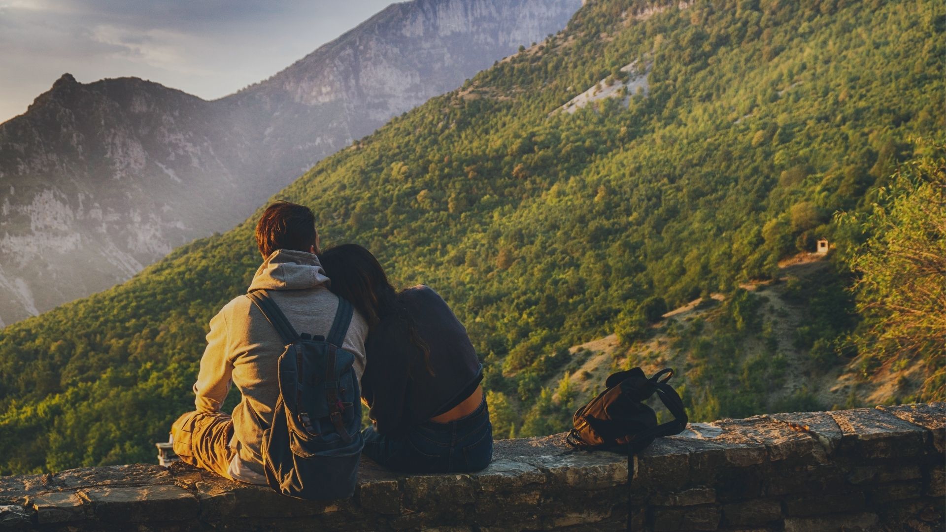 Couple enjoying a scenic mountain view on their honeymoon